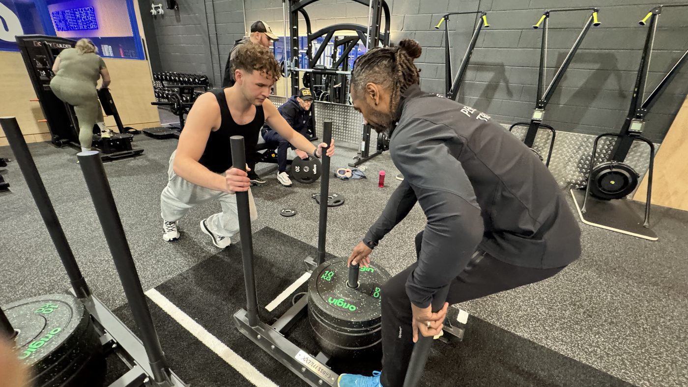 Paul setting up a sled push with a client