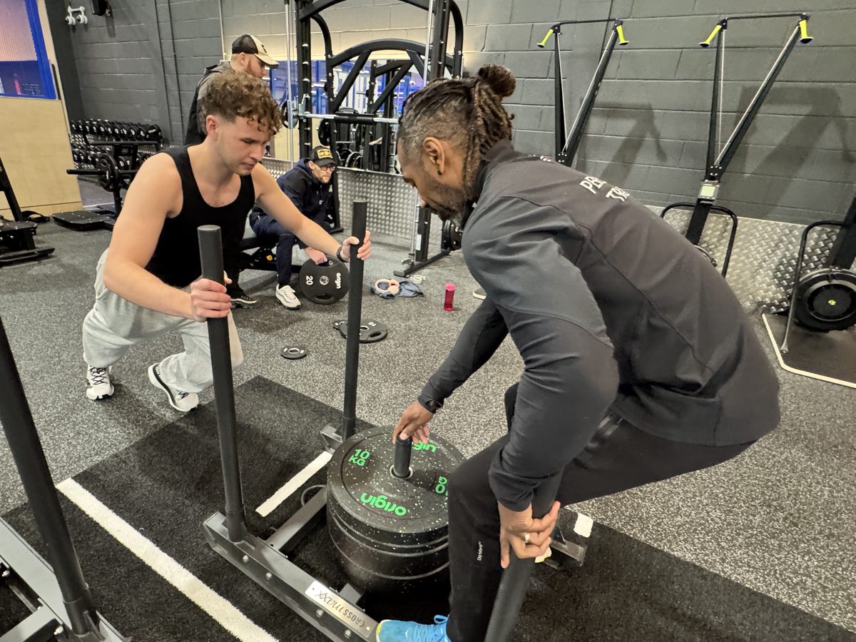 Paul and a client with a weighted sled