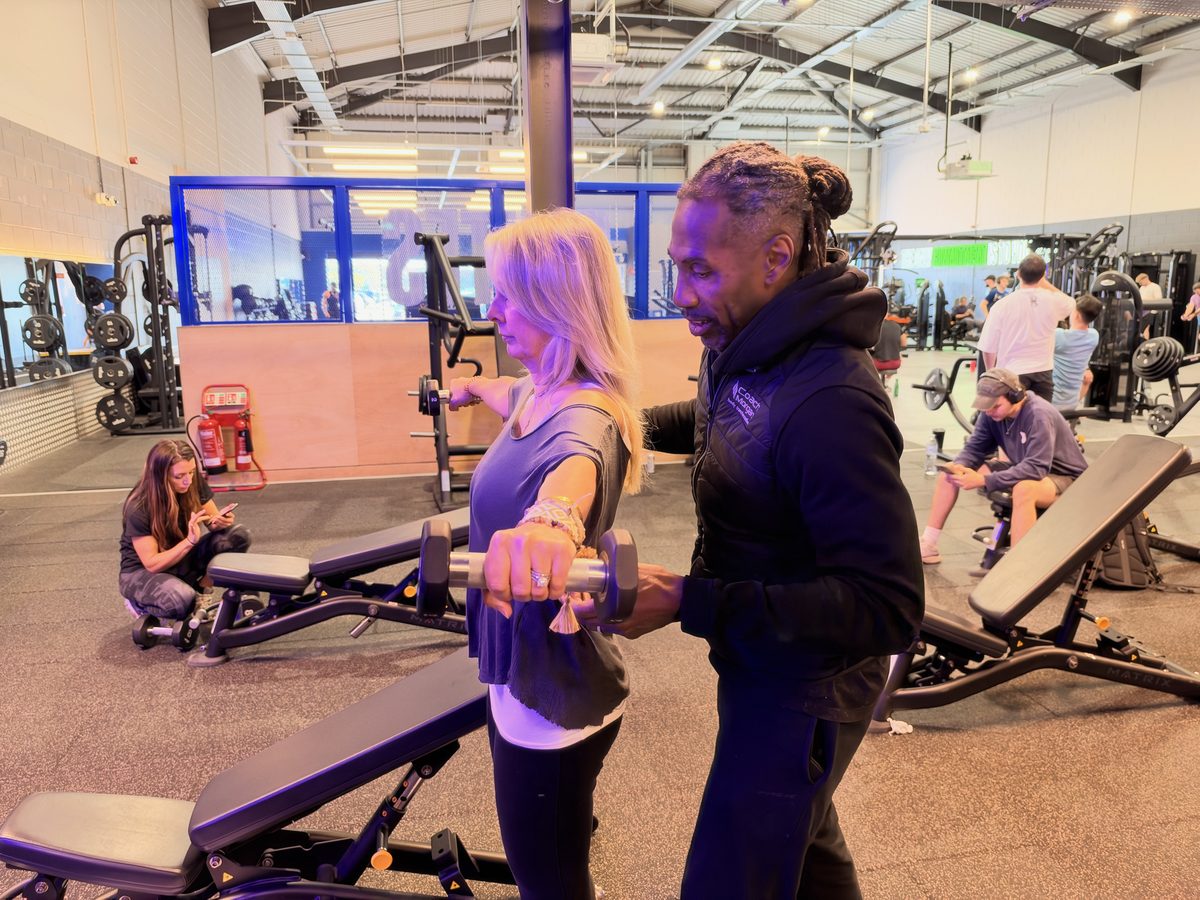 Paul coaching a dumbbell raise